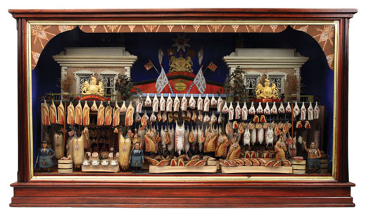 Late-19th-century English butcher shop with butcher figures and an extensive array of carved and painted replicas of various meats, poultry and sausage, $33,350. Noel Barrett Auctions image.